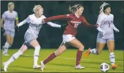  ?? NWA Democrat-Gazette/BEN GOFF • @NWABENGOFF ?? Kayla McKeon (12) of Arkansas drives towards the goal against Arkansas Little Rock defenders Friday in Fayettevil­le.