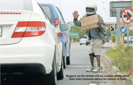  ?? / T H E O J E PT H A ?? Beggers on the streets of East London going about their daily business asking for money or food.