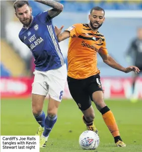  ??  ?? Cardiff’s Joe Ralls tangles with Kevin Stewart last night