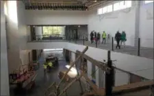  ?? TRENTONIAN FILE PHOTO ?? School district officials in Trenton tour the new Trenton Central High School building under constructi­on Friday, Aug. 10, 2018.