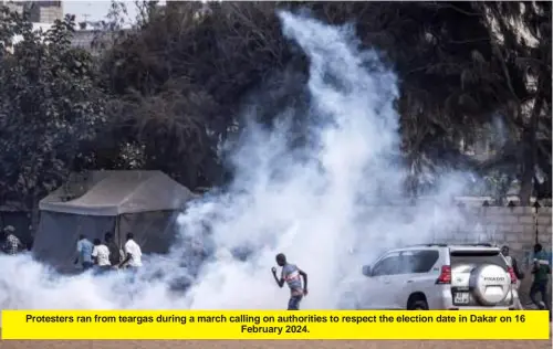  ?? ?? Protesters ran from teargas during a march calling on authoritie­s to respect the election date in Dakar on 16 February 2024.