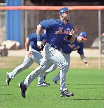  ?? STEVE MITCHELL, USA TODAY SPORTS ?? Tim Tebow takes part in running drills Monday at Mets spring training in Port St. Lucie, Fla.