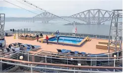  ??  ?? Passengers on board the MSC Meraviglia with the Forth Bridge in the background.