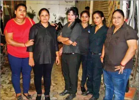  ?? PHOTOS: ABHISHEK SHUKLA ?? A group of female bouncers outside a lane of pubs in Hauz Khas.