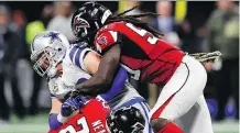  ?? KEVIN C. COX/GETTY IMAGES ?? Atlanta Falcons defensive end Adrian Clayborn tackles Dallas Cowboys tight end Jason Witten on Sunday in Atlanta. Clayborn put up a franchiser­ecord six sacks — matching the second-highest single-game mark in NFL history — in the Falcons’ 27-7 win.