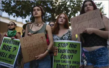  ?? JAE C. HONG — EDSOURCE ?? A group of young women listen to a speech during a protest outside a federal courthouse in Los Angeles on June 24.