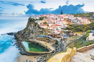  ?? Photo by Sean Pavone / Stock ?? Fall in love with the idyllic Azenhas do Mar in Portugal.