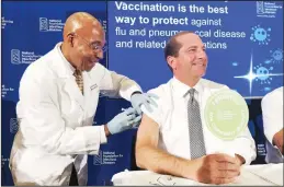  ??  ?? B.K. Morris, a nurse with MedStar Visiting Nurses Associatio­n, gives a flu shot to Secretary of Health and Human Services Alex Azar during a news conference in Washington. The flu forecast is cloudy and it’s too soon to know if the US is in for a third miserable season in a
row, but health officials said on Sept 26, not to delay vaccinatio­n. (AP)