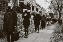  ?? Jason Andrews / New York Times ?? People wait in line to receive a COVID-19 test Thursday in Washington, D.C. Lines for free tests for the coronaviru­s can stretch for blocks and hours in U.S. cities.