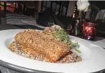  ?? ?? A recent special featured seared salmon with za’atar spice and pepita muhammara. Fish and meat are taking on a bigger role at the eatery.