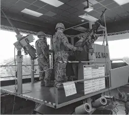  ?? DAVE RESS/STAFF ?? Sailors of the Maritime Expedition­ary Security Force prepare for a new training scenario on their Little Creek simulator.