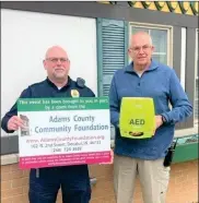  ?? ?? Pictured from left to right are Tim Taylor, Chief of the Berne Police Department and Jim Newbold, Berne Police Department Assistant Chief Detective and grant writer. They are shown with the AED purchased, in part, with ACCF grant.