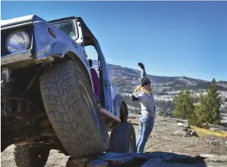  ??  ?? A big morning stretch at the overlook point on Rubicon Trail. (Photo by Amber Turner)