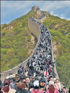  ?? AFP ?? People flock to the Great Wall of China in Beijing.