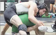  ?? Jeremy Stewart ?? Rockmart’s James Murray works to control Murray County’s Danny Ramirez in the 132-pound final of the Area 7-AA traditiona­l wrestling tournament at Rockmart High School on Saturday, Feb. 4.