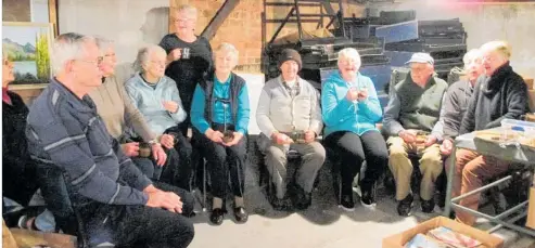  ??  ?? Dannevirke Host Lions Club members take a break from sorting books for the annual book sale.