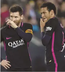  ?? AP PHOTO ?? UGLY: Lionel Messi and Neymar aren’t too pleased during Barcelona’s loss to CF Malaga yesterday. The defending La Liga champs sit second, three points back.