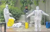  ??  ?? A municipal corporatio­n worker disinfects a health official after the cremation of a Covid-19 victim in Gurugram on Friday. HT PHOTO