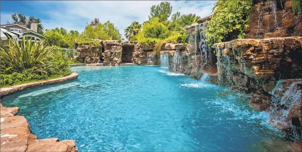  ?? Jeff Elson / TNS ?? Above: Actress Denise Richards sold her Hidden Hills home, which features a lagoon- style pool and a dog spa, for $ 4.395 million. Below left: Dennis Quaid is ready to part with the Spanish- style house he bought five years ago in Pacific Palisades. Below right: Built in 1991, Denise Richards’ Hidden Hills home boasts a range of custom details.