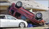  ?? ALONZO ADAMS/AP ?? Vehicles were slung around Feb. 27 in Norman, Oklahoma, after rare severe storms and tornadoes moved through overnight.