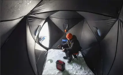  ?? GARY YOKOYAMA, THE HAMILTON SPECTATOR ?? It’s cold, but that does not mean ice is safe. Currents can stop ice from forming and snow can insulate and hide areas of open water or hide thin ice, warn experts. Make sure signs ensure safe ice before venturing out. Here, James Gallant, 21, is doing...