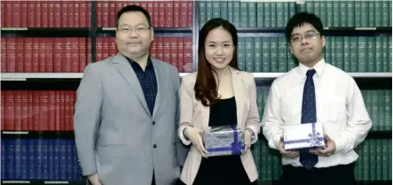  ??  ?? ( From left) ATC chief executive officer- cum- principal Dr Danny Choong with Daphne Sit Wei Jing and Tan Chuan Yi.