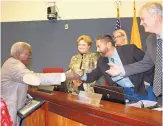  ?? COURTESY OF BERNALILLO COUNTY ?? Don Perkins, left, is congratula­ted by Bernalillo County Commission members at a ceremony Tuesday in which it was proclaimed that 2018 will be the Year of Donald A. Perkins.