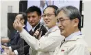  ?? Photograph: JIJI Press/AFP/Getty Images ?? Yuichi Tsuda (second right), Hayabusa-2 project manager at the Japanese space agency Jaxa, at a press conference in Sagamihara, Kanagawa prefecture, last week.