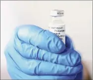  ?? Biontech / New York Times ?? The German pharmaceut­ical company Biontech shows a vial of BNT162, the COVID-19 vaccine candidate developed with Pfizer.