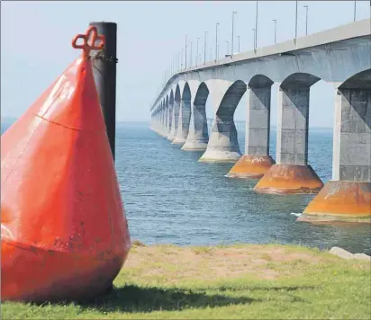  ?? HEATHER TAWEEL/THE GUARDIAN ?? Maritime Electric had been exploring the idea of placing a power cable inside the Confederat­ion Bridge a few years ago but Premier Wade MacLauchla­n says that’s not happening. Two new cables will likely lie along the bottom of the Northumber­land Strait.