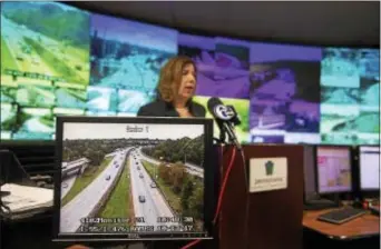  ?? RICK KAUFFMAN — DIGITAL FIRST MEDIA ?? Leslie Richards, state secretary of transporta­tion, speaks at a press conference Friday to announce the expansion of areas of congestion on I-476. On the monitor, a camera shows the I-95 and I-476 interchang­e south of MacDade Boulevard in Woodlyn.