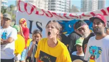  ?? Pictures: ALEX COPPEL AND ADAM HEAD ?? Protesters chant at a demonstrat­ion on Kurrawa Beach during Channel 7’s Sunrise broadcast.