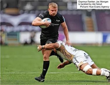  ?? ?? Ospreys flanker Jac Morgan is tackled by Aki Seiuli
Picture: Huw Evans Agency