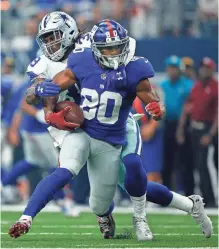  ?? ERICH SCHLEGEL, USA TODAY SPORTS ?? Giants wide receiver Victor Cruz, playing for the first time since October 2014, is tackled by Brandon Carr on Sunday.