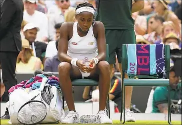  ?? Kirsty Wiggleswor­th Associated Press ?? COCO GAUFF, just 15 years old, reached the fourth round at Wimbledon but lost to Simona Halep on Monday.