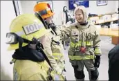  ?? Dania Maxwell Los Angeles Times ?? SUPERVISOR Janice Hahn tries on the personal protective equipment used by both male and female firefighte­rs in the L.A. County Fire Department.