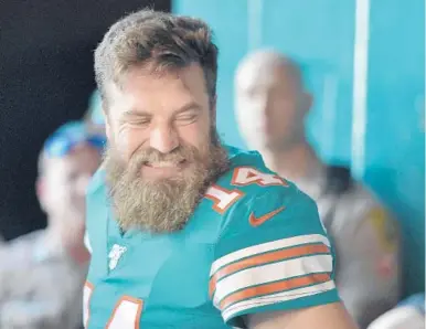  ?? MICHAEL LAUGHLIN/SUN SENTINEL ?? Dolphins quarterbac­k Ryan Fitzpatric­k smiles before playing the Eagles on Dec. 1.
