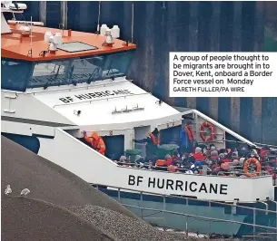  ?? GARETH FULLER/PA WIRE ?? A group of people thought to be migrants are brought in to Dover, Kent, onboard a Border Force vessel on Monday