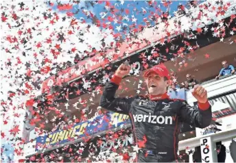  ?? MEL EVANS, AP ?? Will Power celebrates in victory lane after winning the ABC Auto Supply 500 on Monday to close within 20 points of leader Simon Pagenaud in the Verizon IndyCar Series.