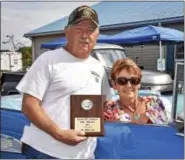  ??  ?? Erv and Becky Steinly took the 1st Place Car award back home to Mohrsville in their immaculate 1957 Chevy Bel Air convertibl­e.