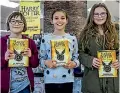  ??  ?? These three happy Harry Potter fans got the first copies of the new novel in Christchur­ch.