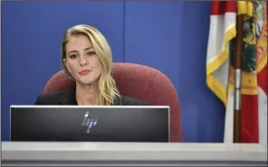  ?? (AP/Sarasota Herald-Tribune/Mike Lang) ?? Sarasota County School Board member Bridget Ziegler listens to public comments in December 2023 after her fellow school board members approved a resolution calling on her to resign.