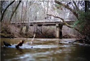  ?? Associated Press, File ?? ■ A bridge that spans the Apalachee River at Moore’s Ford Road is seen Feb. 22, 2018, in Monroe, Ga. In 1946, two young black couples were stopped here by a white mob. Members of the mob dragged them to the riverbank and shot them multiple times. The gruesome lynching is prompting a U.S. court to consider whether federal judges can order grand jury records unsealed in old cases with historical significan­ce.