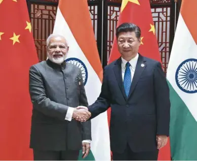  ??  ?? Chinese President Xi Jinping meets with Indian Prime Minister Narendra Modi on the sideline of the 9th BRICS Summit and the Dialogue of Emerging Market and Developing Countries in Xiamen, China on September 5, 2017.