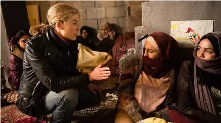  ??  ?? The story of Marie Colvin, played by Rosamund Pike, befits a big-screen portrait