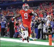  ?? TOM PENNINGTON / GETTY IMAGES ?? Clemson running back Travis Etienne finishes off a 62-yard touchdown run in the third quarter against Notre Dame in a CFP semifinal at AT&amp;T Stadium in Arlington, Texas.