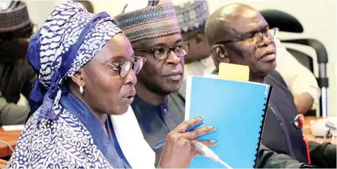  ?? ?? Permanent Secretary, Federal Ministry of Health, Daju Kachollom ( left); Director, Finance and Accounts, Ityohuma Saawua and Director, Procuremen­t, Mohammed Abdullahi during COVID- 19 interventi­on fund probe, at the National Assembly, Abuja.