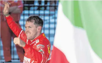  ?? FOTO: IMAGO ?? Ein großer Tag für Italien – und für Sebastian Vettel: Nach 553 Tagen ohne Grand-Prix-Sieg hat der Heppenheim­er am Sonntag im Ferrari den Großen Preis von Australien gewonnen.