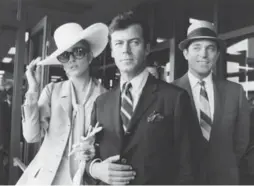  ?? UNITED ARTISTS/PHOTOFEST ?? Canadian actor Gordon Pinsent, centre, in The Thomas Crown Affair.