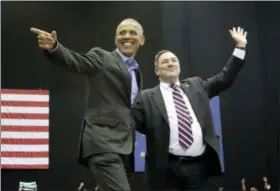  ?? NAM Y. HUH — THE ASSOCIATED PRESS ?? Former President Barack Obama, left, points as Democratic gubernator­ial candidate U.S. Sen. Joe Donnelly waves to the crowd during a campaign rally at Genesis Convention Center in Gary, Ind., Sunday.